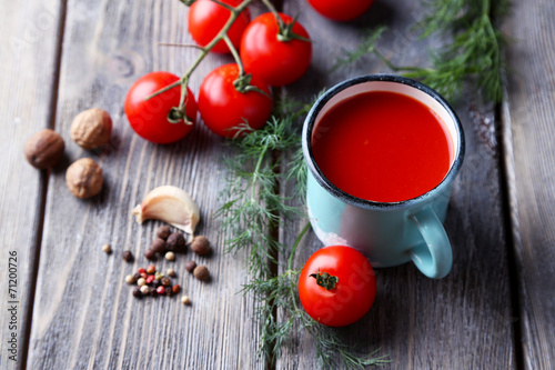 Homemade tomato juice in color mug  spices and fresh tomatoes