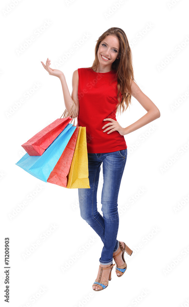 Beautiful young woman with shopping bags isolated on white Beautiful young woman with shopping bags isolated on white