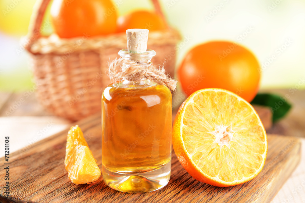 Tangerine oil on table on light background Tangerine oil on table on light background