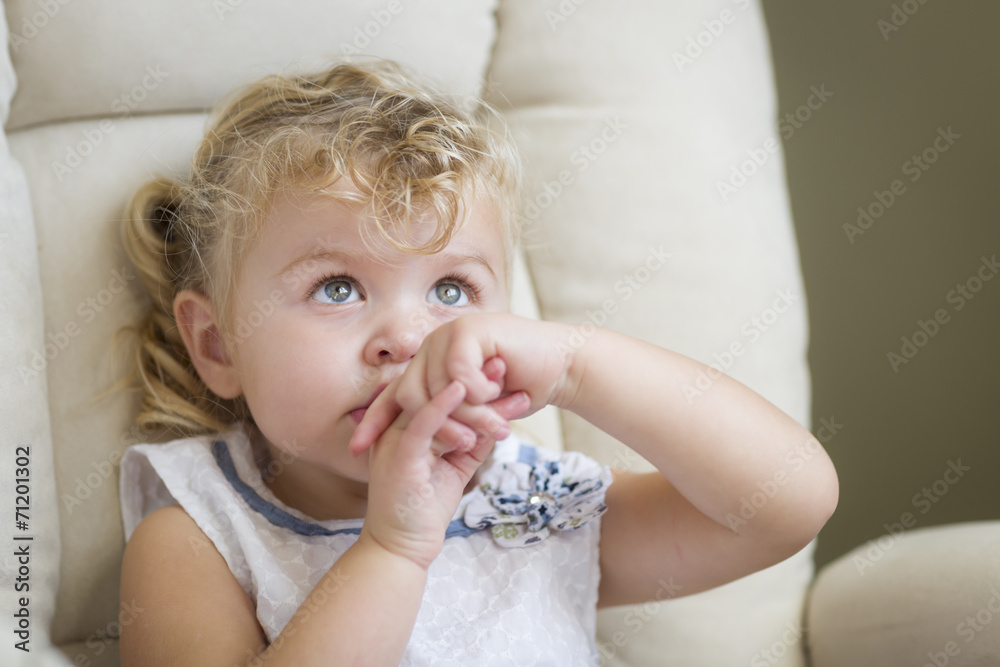 Adorable Blonde Haired and Blue Eyed Little Girl in Chair Adorable Blonde Haired and Blue Eyed Little Girl in Chair