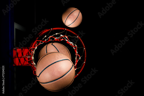 Basketball on  black background with light effect © torsak