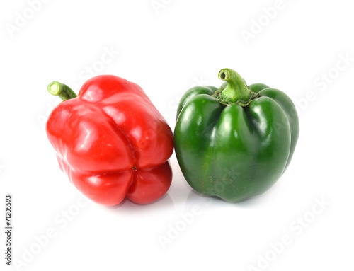 Green, red bell peppers on a white background