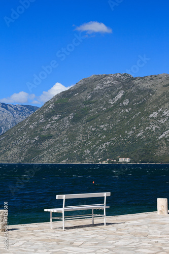Bench on the promenade in the Bay of Kotor, Montenegro
