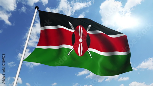 flag of Kenya with fabric structure against a cloudy sky