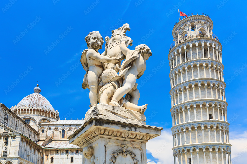 The statue of angels and the leaning tower. Pisa, Italy