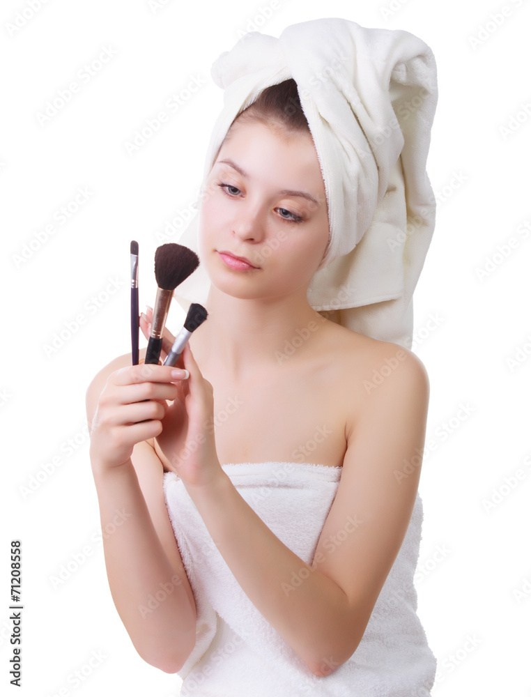 The young girl after a shower with brushes for a make-up The young girl after a shower with brushes for a make-up
