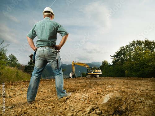 engineer evaluating construction progress