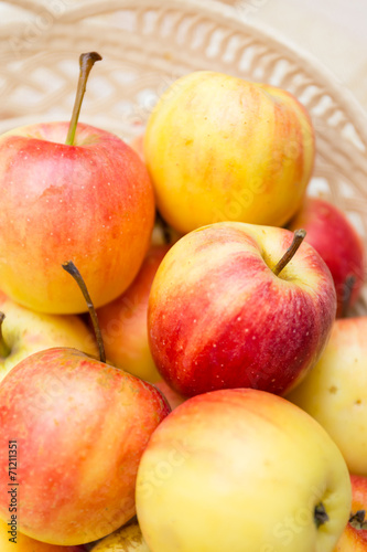 close up apples in a basket