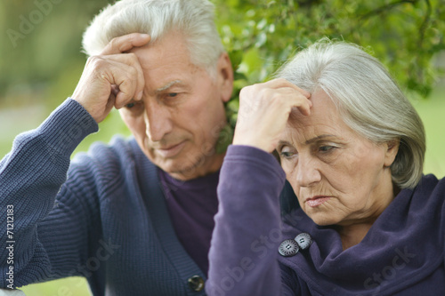 sad elder couple