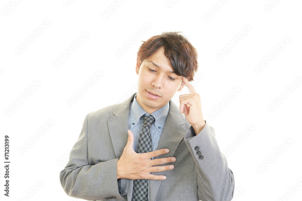 困惑した表情のビジネスマン