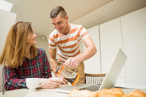 Cute couple having coffee together