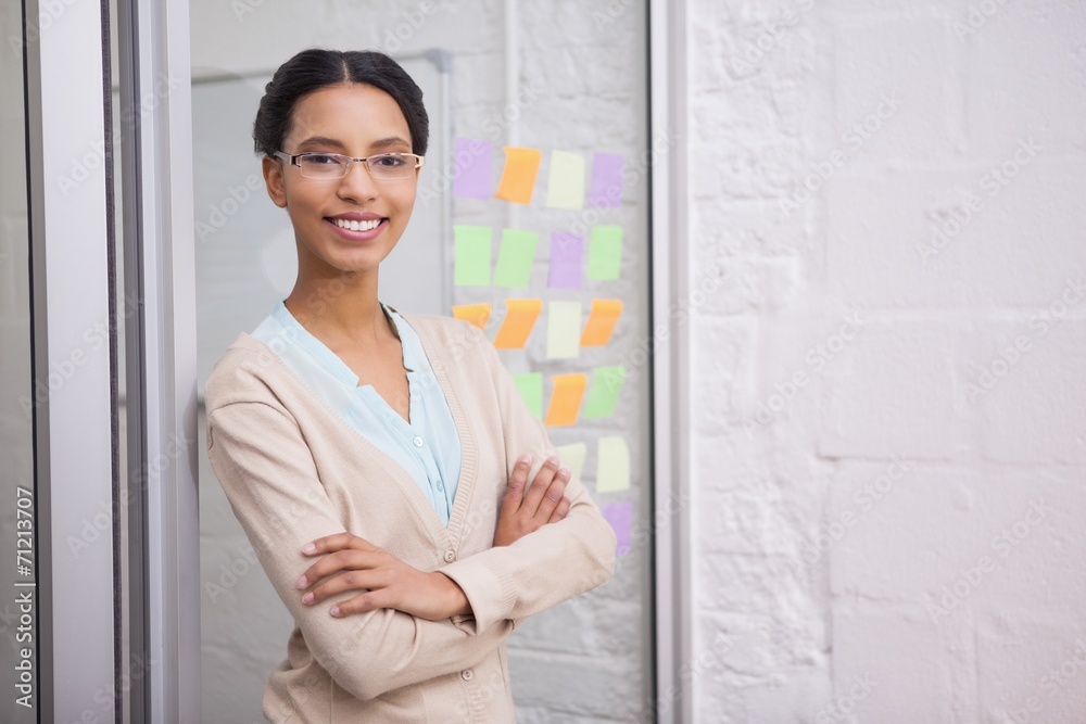 Businesswoman wearing glasses and smiling at camera Businesswoman wearing glasses and smiling at camera