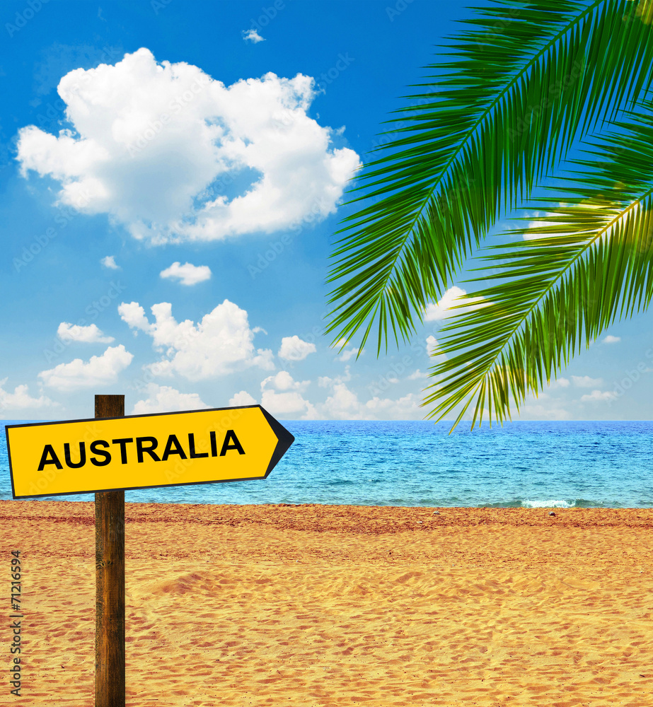 Naklejka premium Tropical beach and direction board saying AUSTRALIA