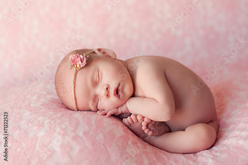 Sleeping Newborn Baby Girl on Pink