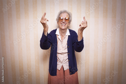 Photos cool elder lady making middle finger sign