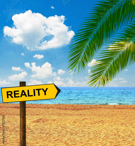 Картината върху платно Tropical beach and direction board saying REALITY