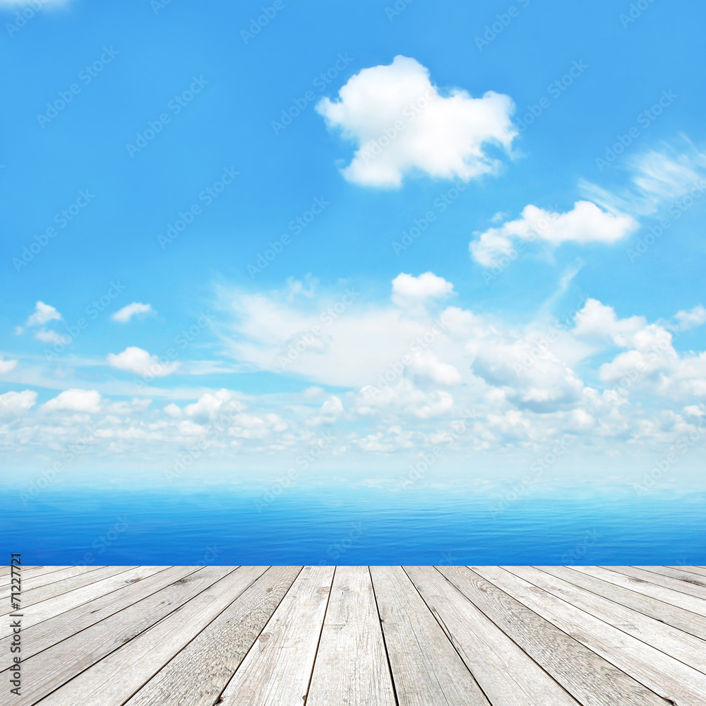Wood plank as a pier on blue sky background