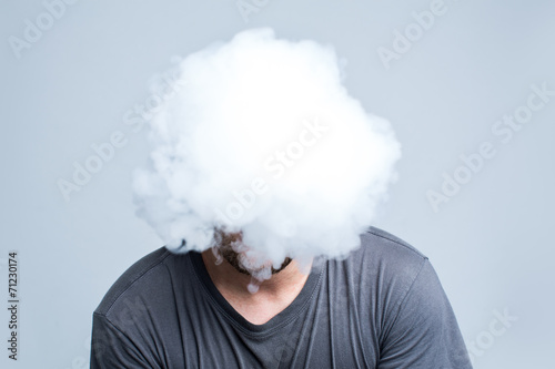 Face covered with thick smoke