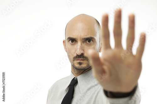 Businessman giving hand stop sign
