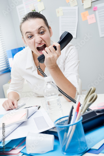Businesswoman shouting at phone