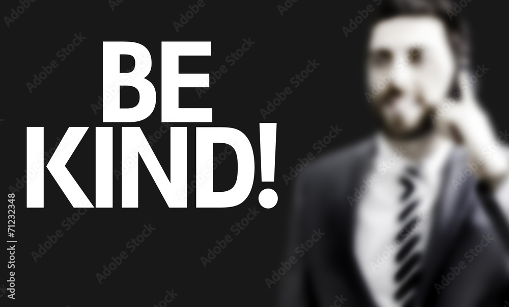 Business man with the text Be Kind in a concept image Business man with the text Be Kind in a concept image