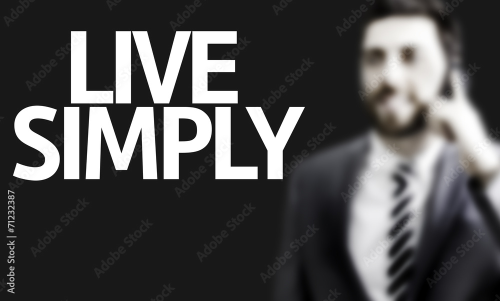Business man with the text Live Simply Business man with the text Live Simply