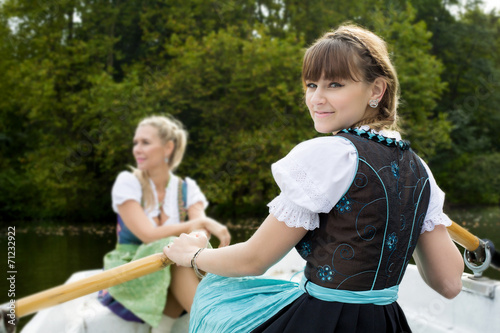 two woman in a rowing boat