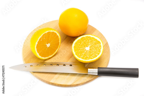 orange on a cutting board and knife
