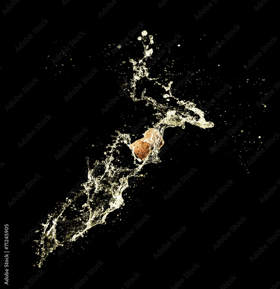 Champagne splashes with cork on black background