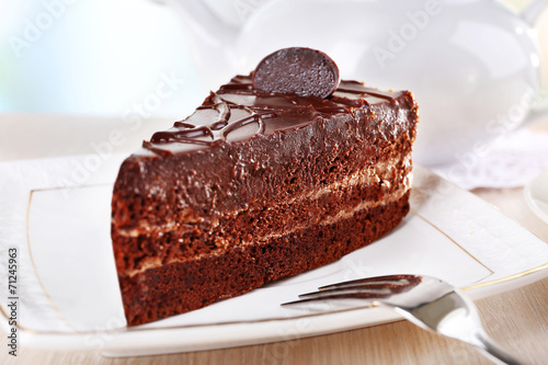Piece of chocolate cake on plate photo