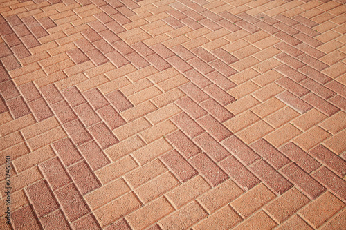 Background texture of red cobblestone pavement pattern