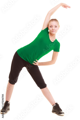 Sport. Flexible fitness girl doing stretching exercise