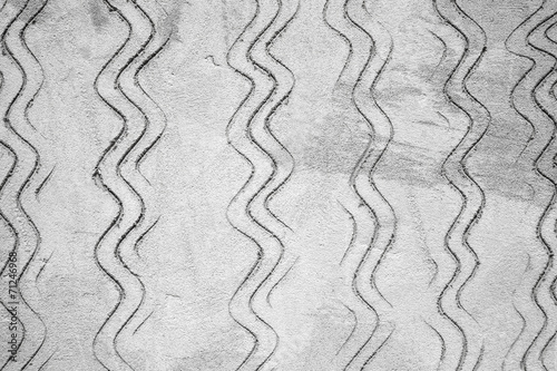 Gray concrete wall texture with waved pattern