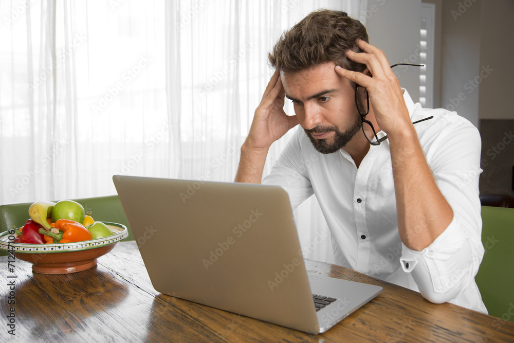 Surprised man reading bad news Surprised man reading bad news
