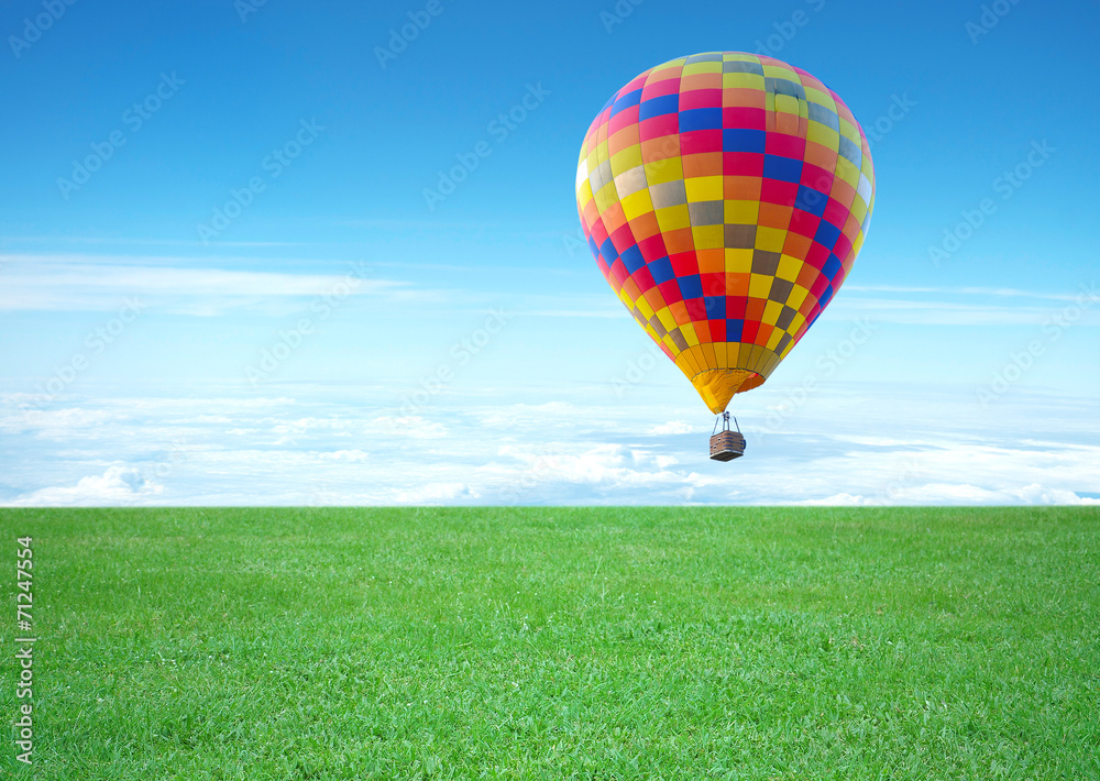 Naklejka premium colorful hot air balloon with beautiful blue sky and cloud