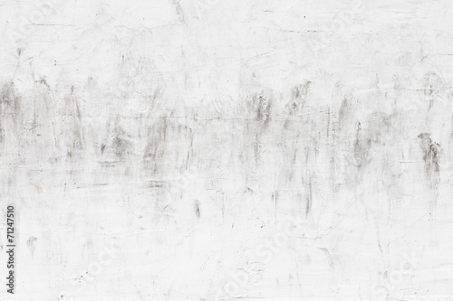 White concrete wall with dirty stucco, background photo texture © evannovostro
