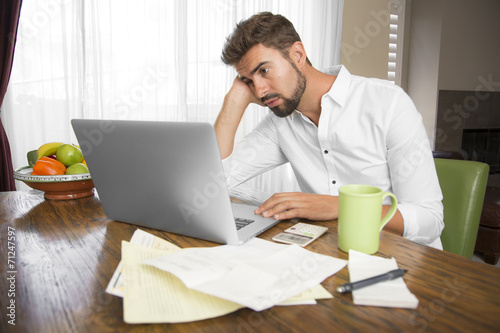 Unproductive man working at home looking for inspiration