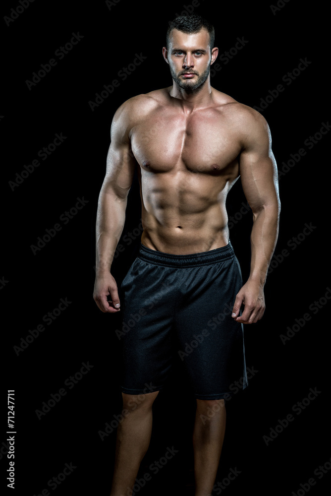 Man posing in gym