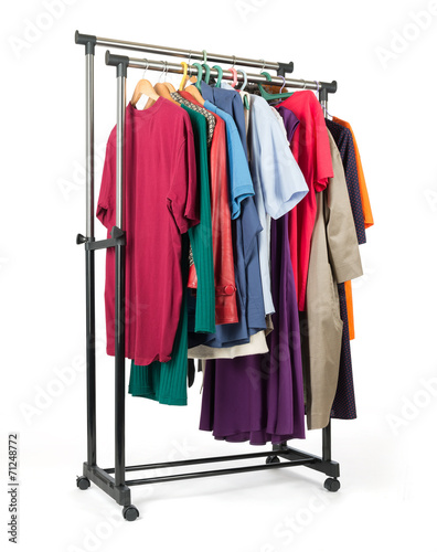 Mobile rack with clothes on white background