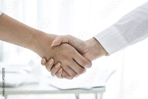 Woman greeting with handshake