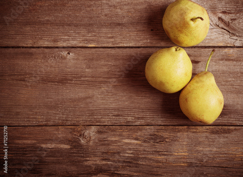 pears fruits on old wooden table background