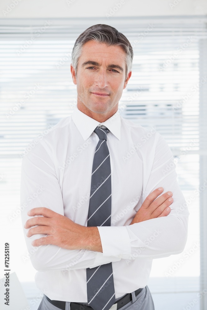 Fototapeta premium Serious businessman with folded arms