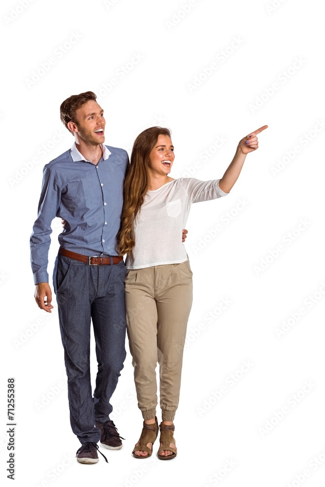 Full length of couple looking away