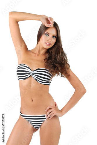 Beautiful young woman in striped swimsuit isolated on white