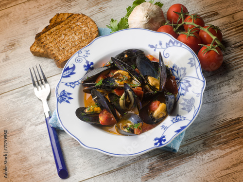 mussel soup with toasted bread photo