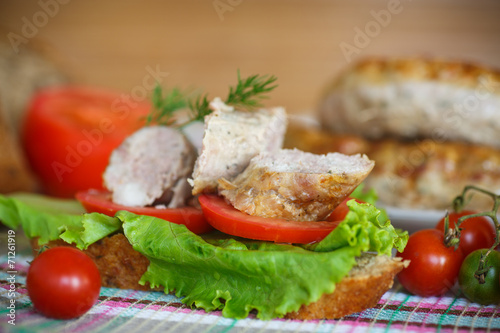 sandwich with tomatoes and homemade sausage