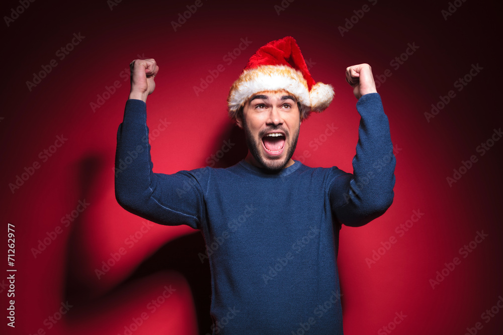 Happy young santa man celebrating Happy young santa man celebrating