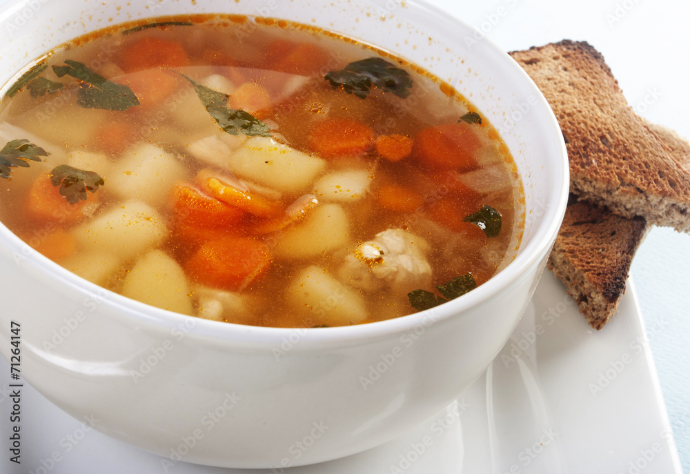 Chicken soup with vegetables close up Chicken soup with vegetables close up
