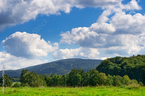 Mountain Landscape Under Blue Sky and White Light Clouds.