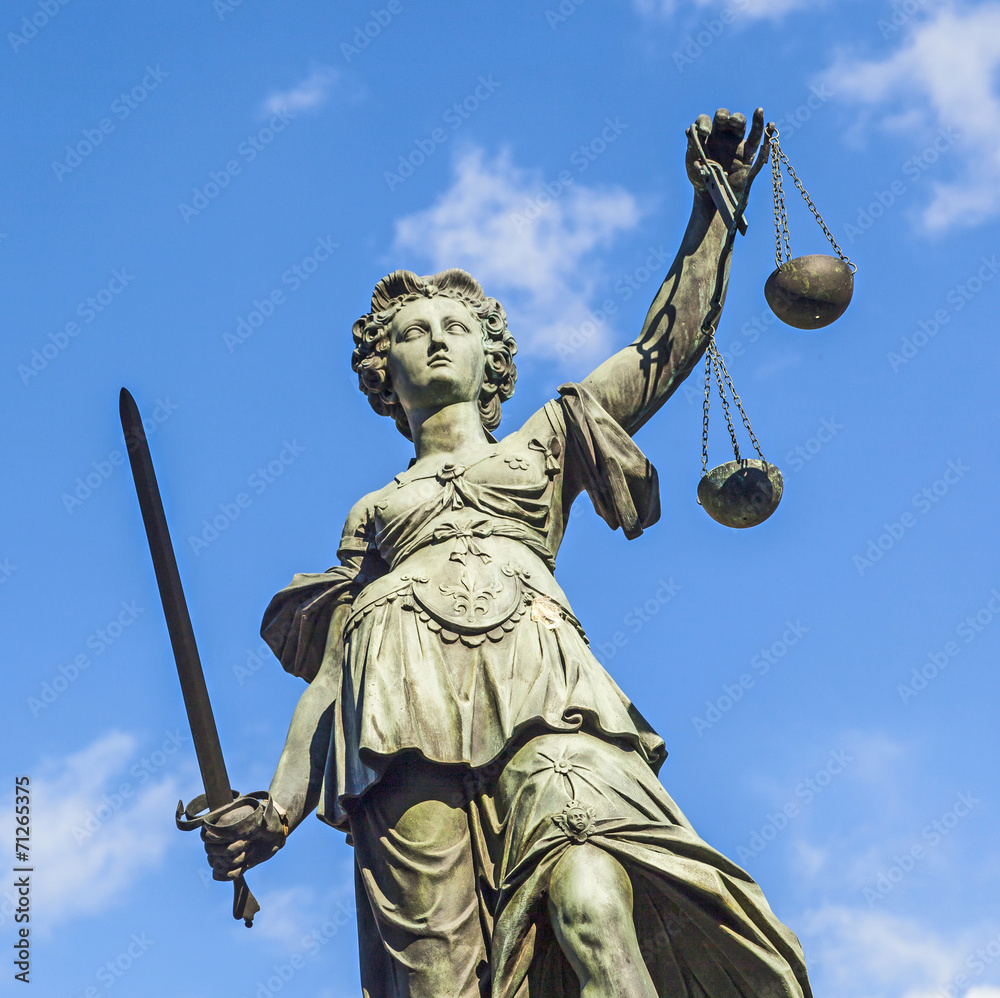 Justitia (Lady Justice) sculpture on the Roemerberg square in Fr Stock